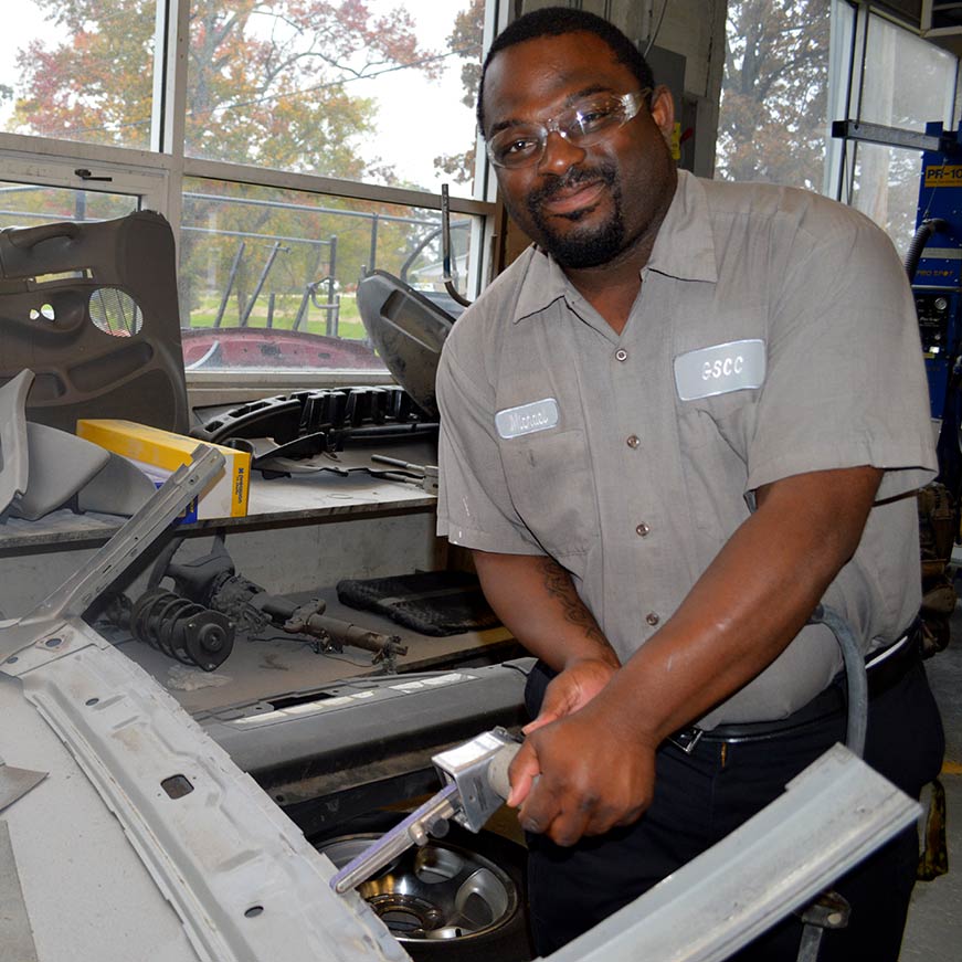 Student working in a mechanic shop