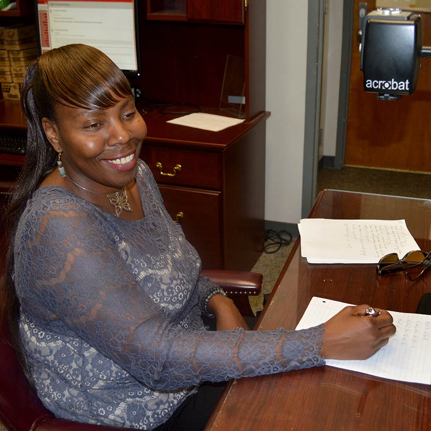 Administrator writing on paper