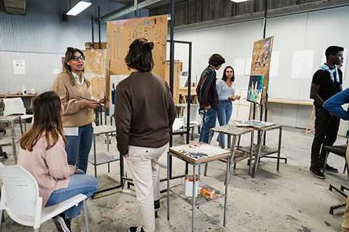 Students in art classroom with teacher