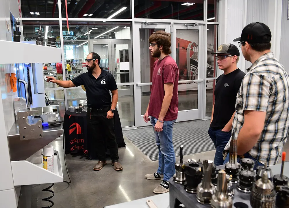 Students in lab with large machines