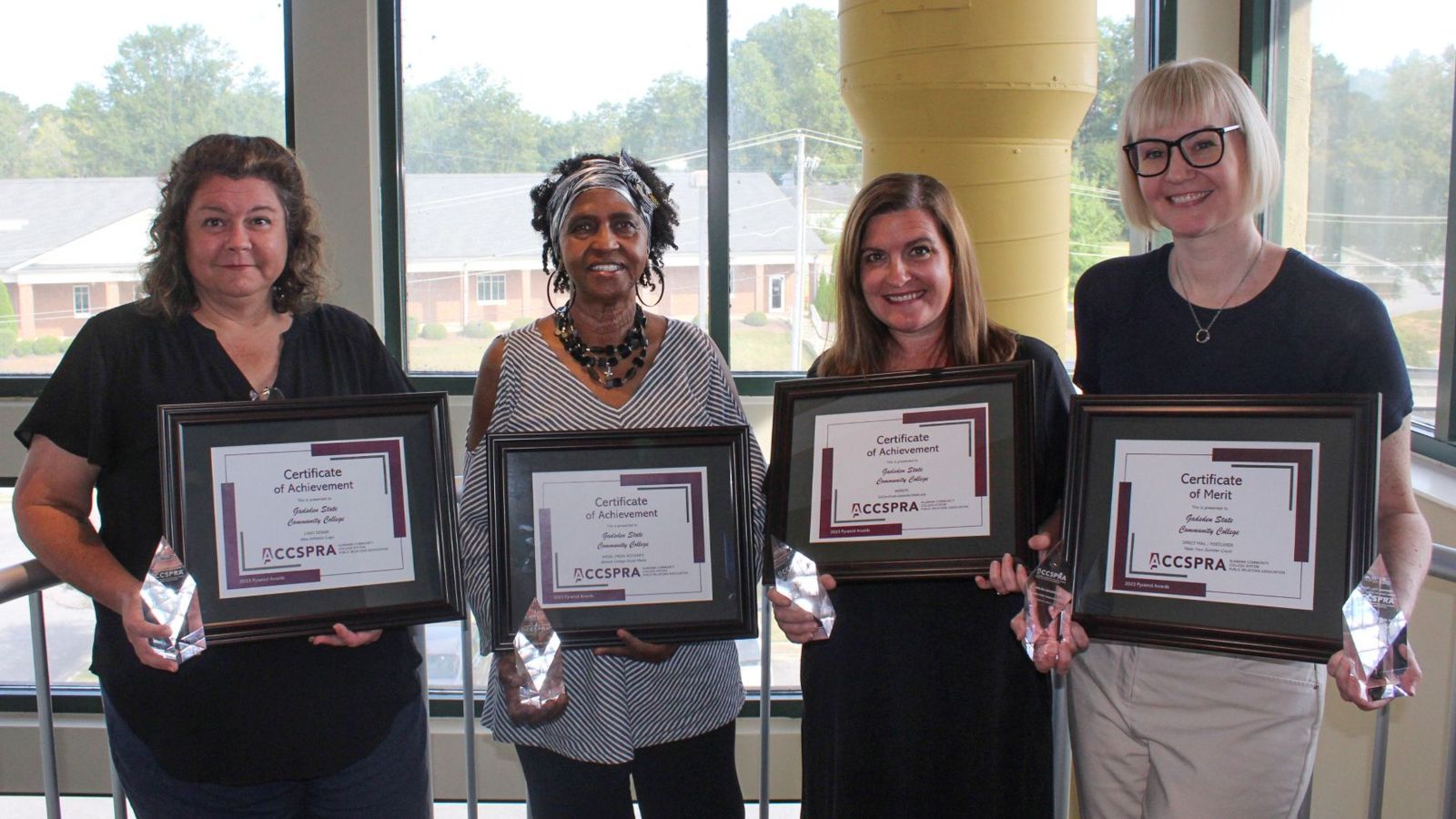 Members of the Gadsden State PR and Marketing Department hold some of the trophies earned at the ACCSPRA Conference. From left to right are Brandy Hyatt, public relations and marketing specialist; Kathy Brown, administrative assistant; Jackie Edmondson, director; and Laura Catoe, web design/social media specialist.
