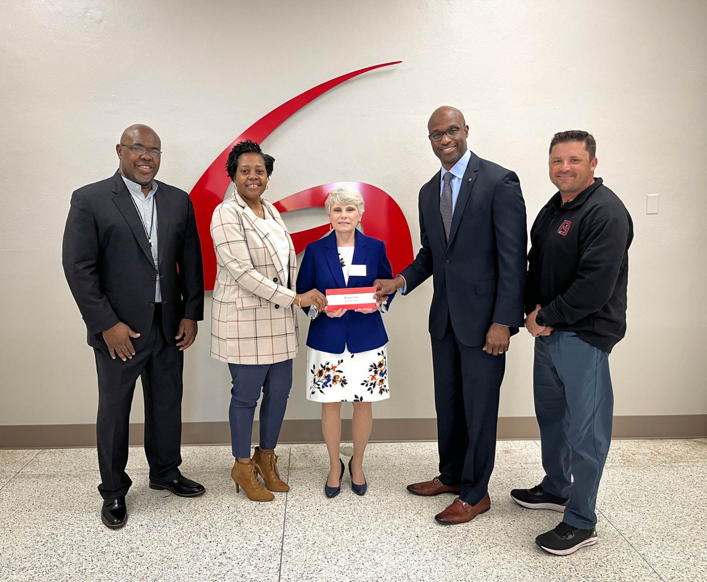 : A check for $50,000 was presented to Dr. Kathy Murphy, middle, president of Gadsden State, and to Blake Lewis, far right, athletic director. Pictured are, from left, Spencer Williams, community relations manager in Etowah County; Dana McFarland, community relations manager in Calhoun County; and Terry Smiley, vice president of Alabama Power’s Eastern Division.