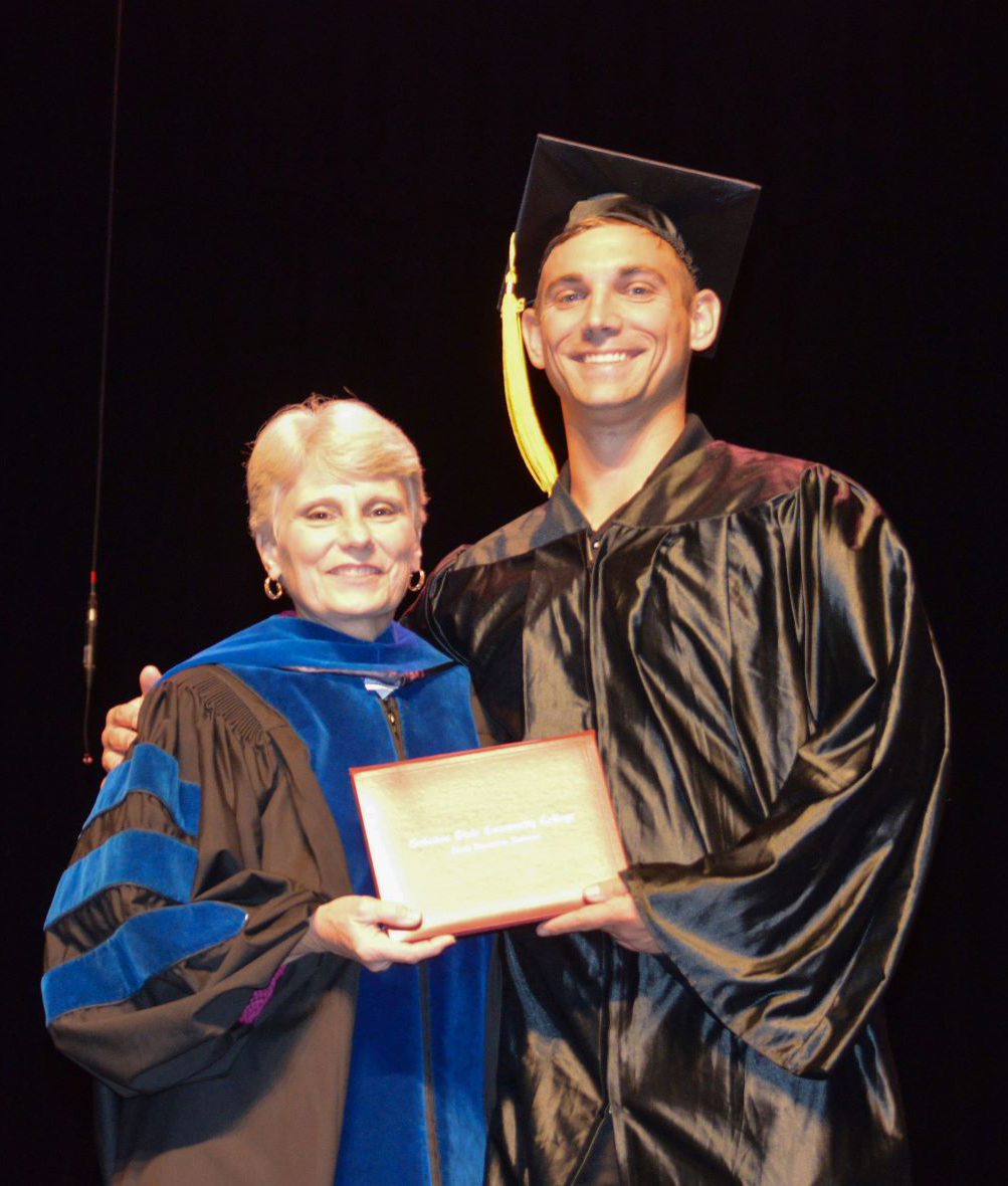 Dr. Murphy and Sawyer at the GED graduation