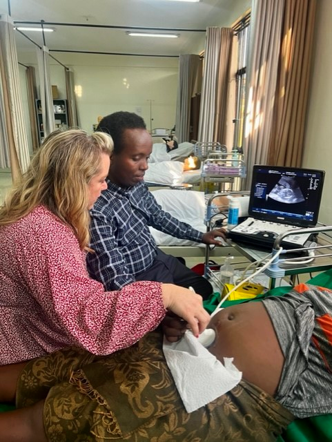 Rebecca Southern teaches Chris Kanakuzi how to do an obstetrics ultrasound exam during a trip to Rwanda in July. She will be going to Malawi next week with a fellow instructor and a Gadsden State student on a trip focused on training on imaging equipment.