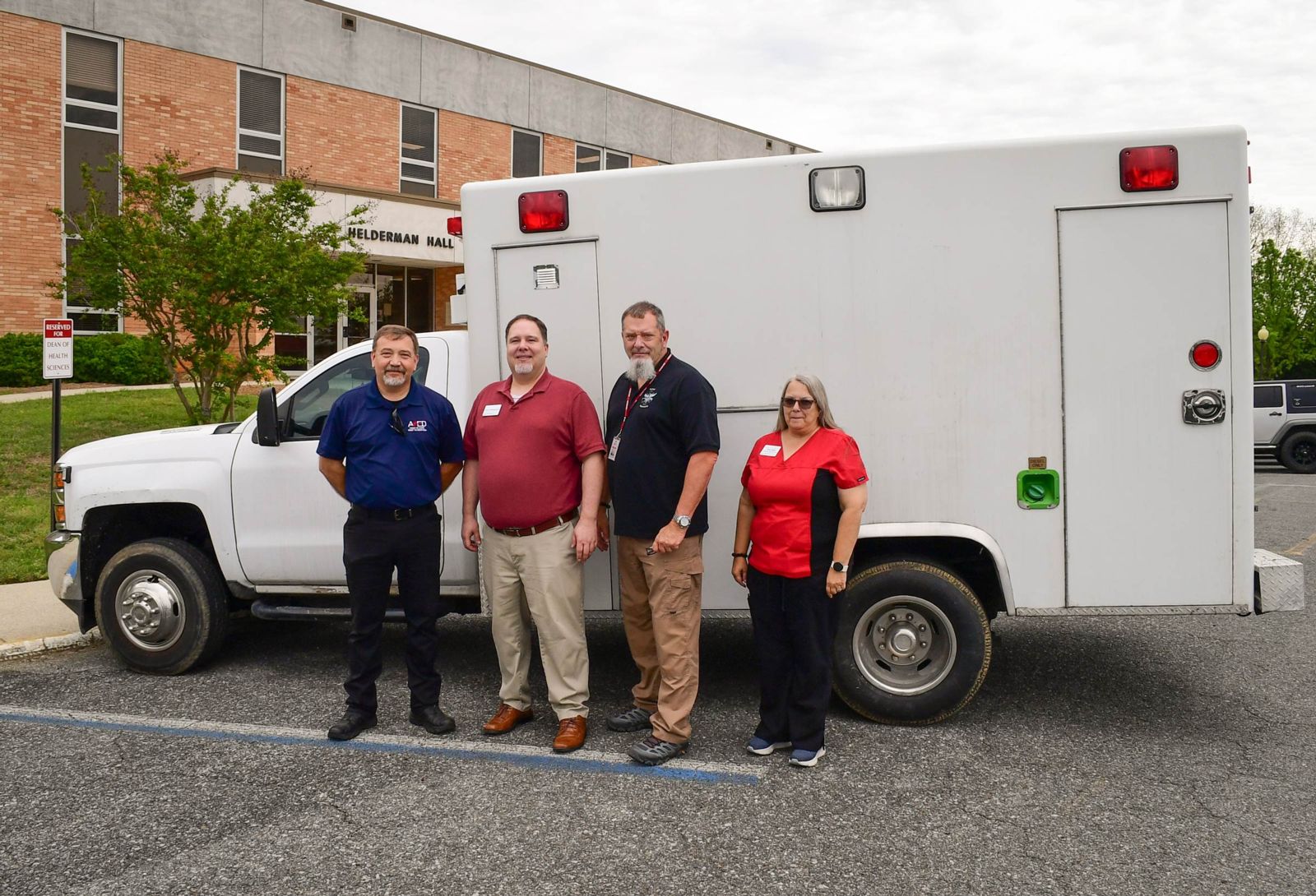 Pictured with the donated ambulance are, from left, Patrick Bright, director of operations for AMED; John Hollingsworth, director of Gadsden State’s EMS Program; Brian Selke, faculty member; and Tracy Shew, faculty member.